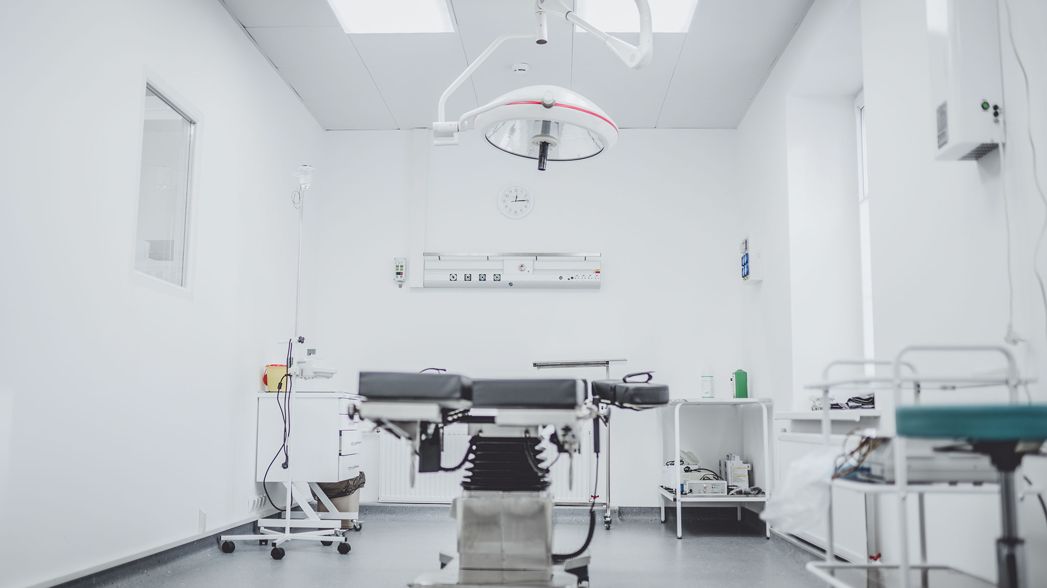 An empty NHS operating theatre with modern equipment