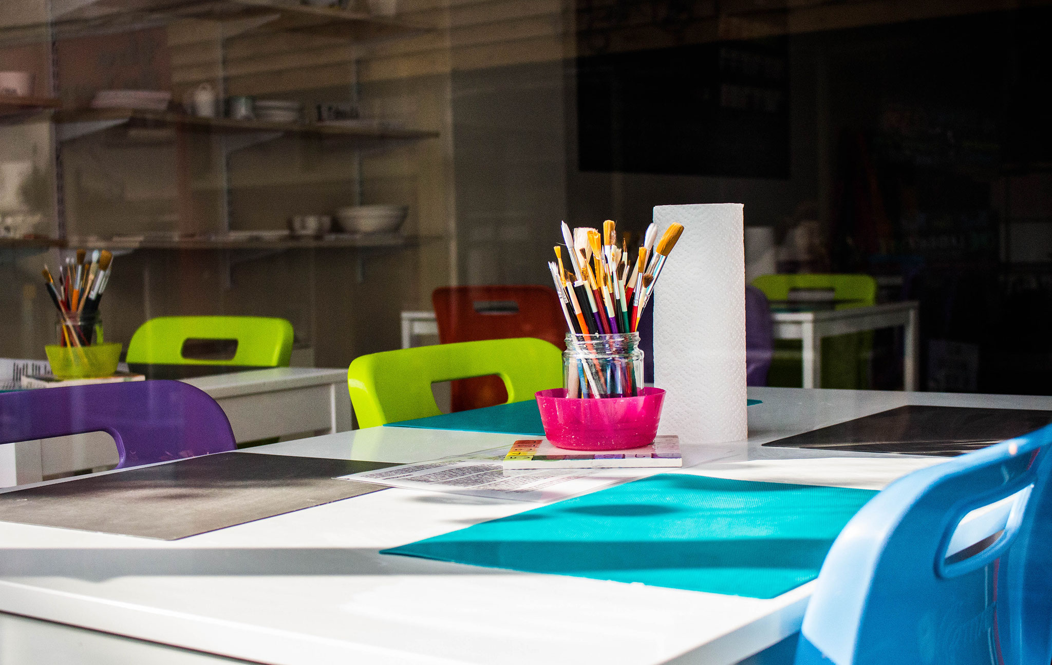 A classroom table used for an art lesson.