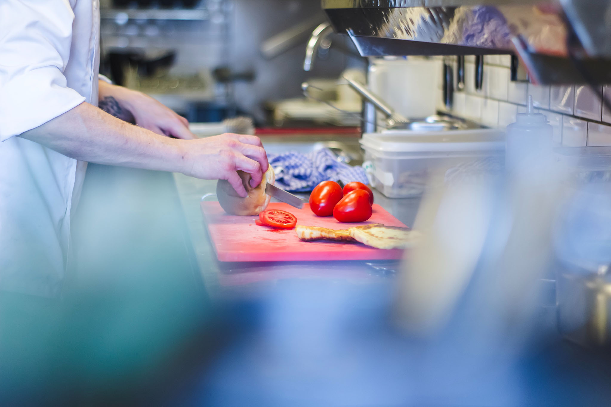 A school chef prepares school meals in the canteen kitchen.