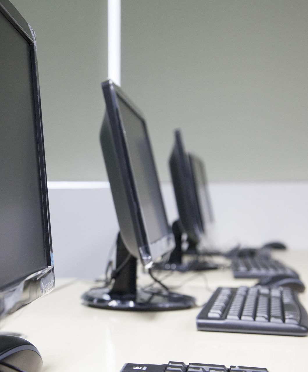 A row of computer in a school computer suite