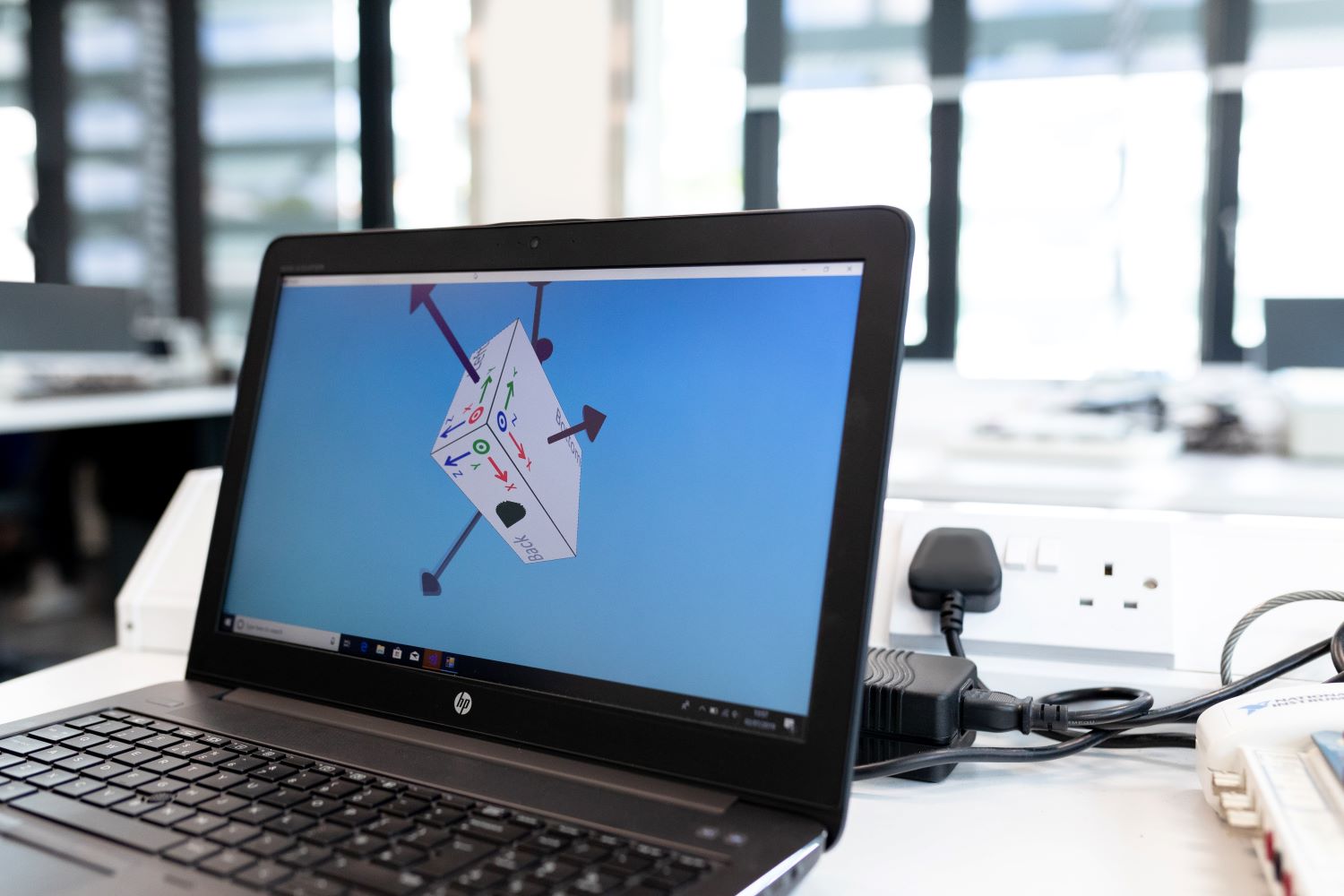 A school laptop showing a science demonstration